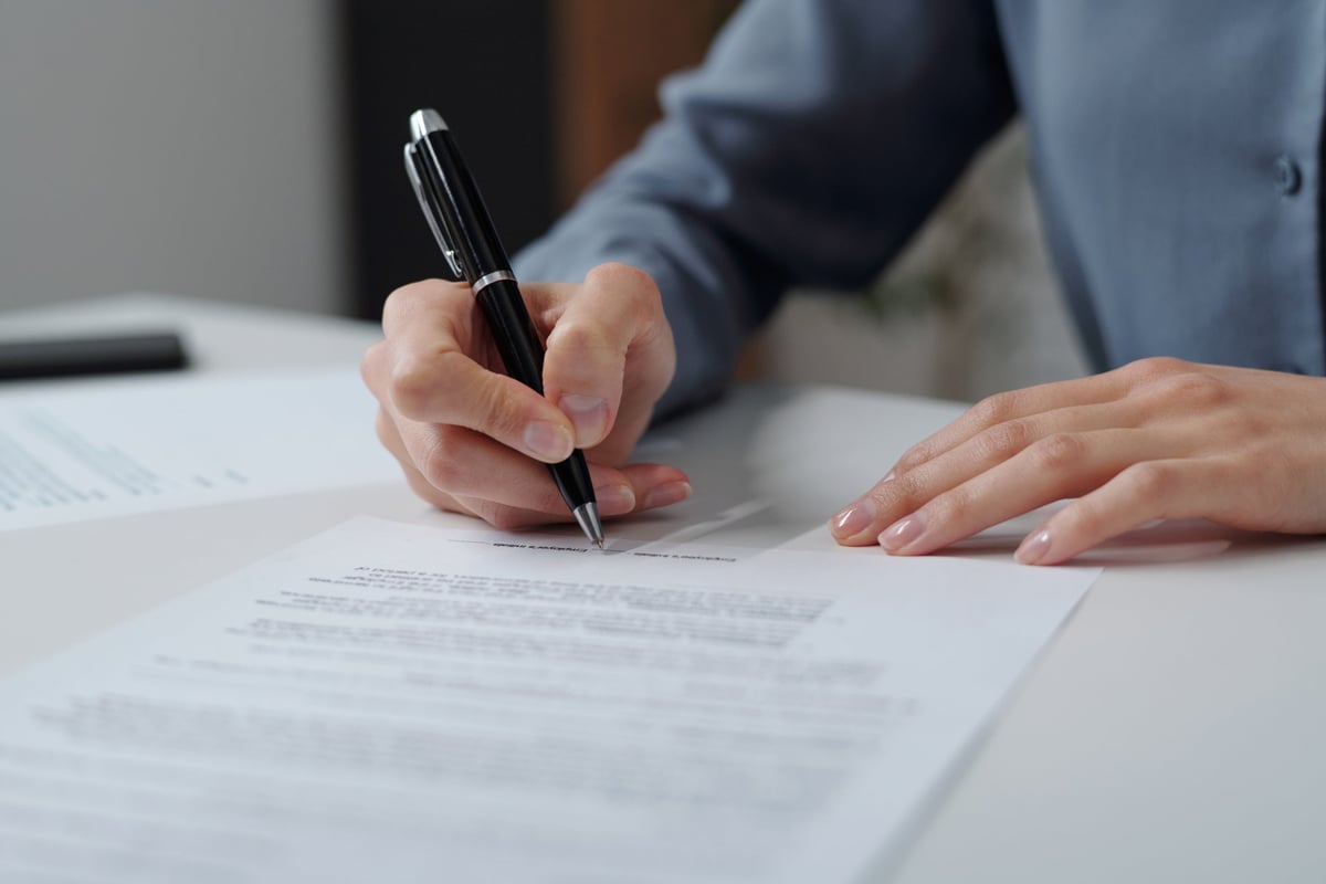 Contract document being signed